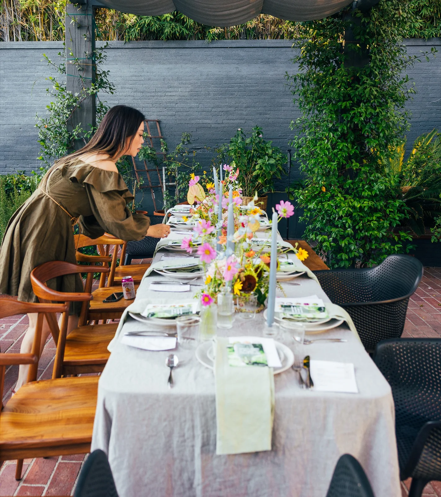 Jennifer Joo, floral designer, styling a table with flowers